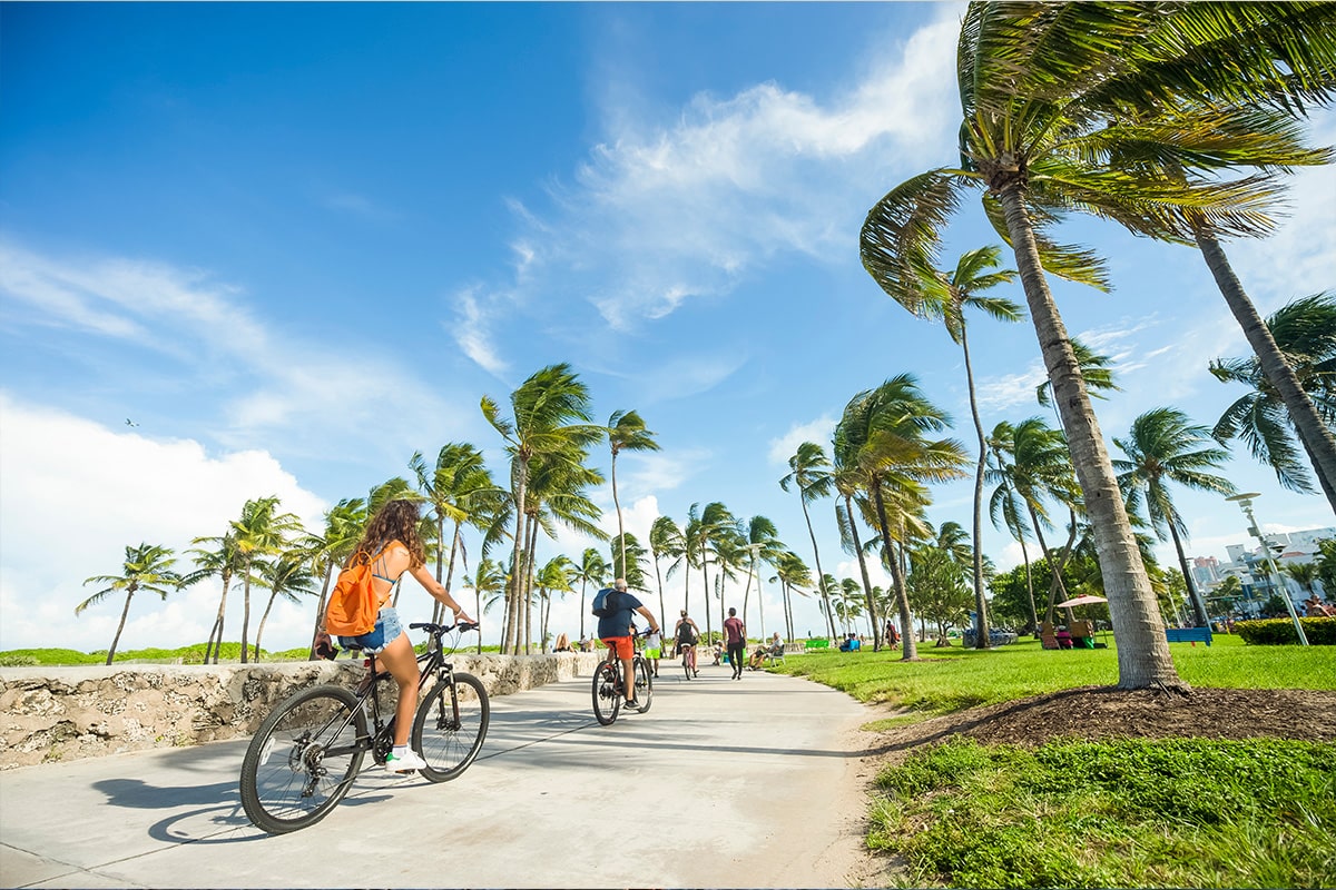 Couple on bikes in florida beach