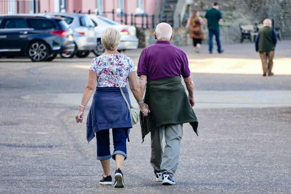 Older couple walking together outdoors