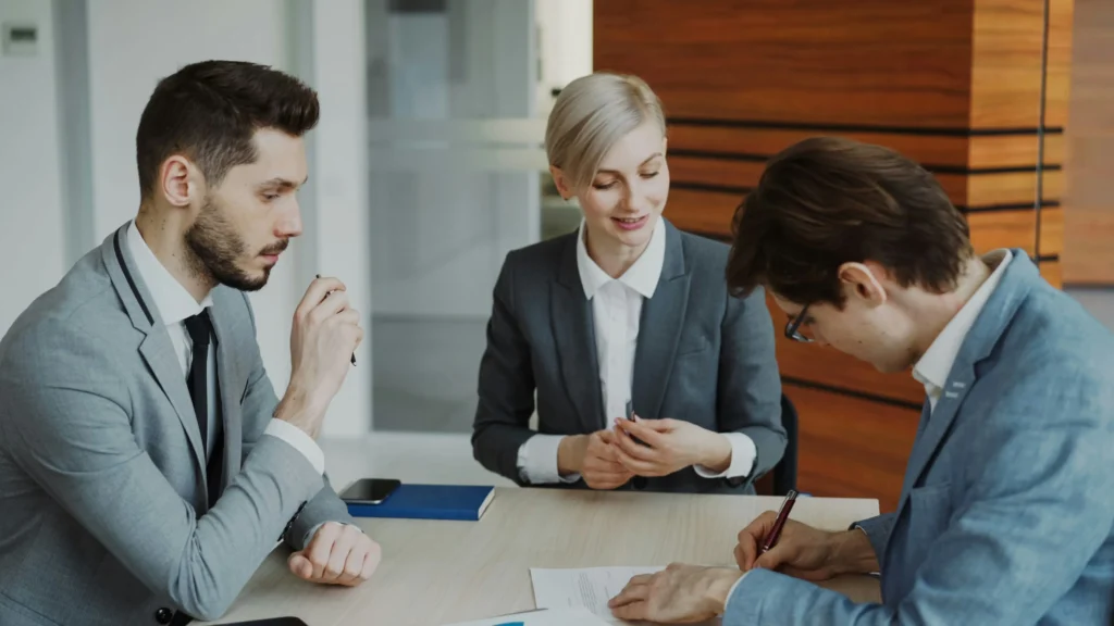 Health insurance advisors guiding Florida small business owners through selecting the right employee health insurance coverage.