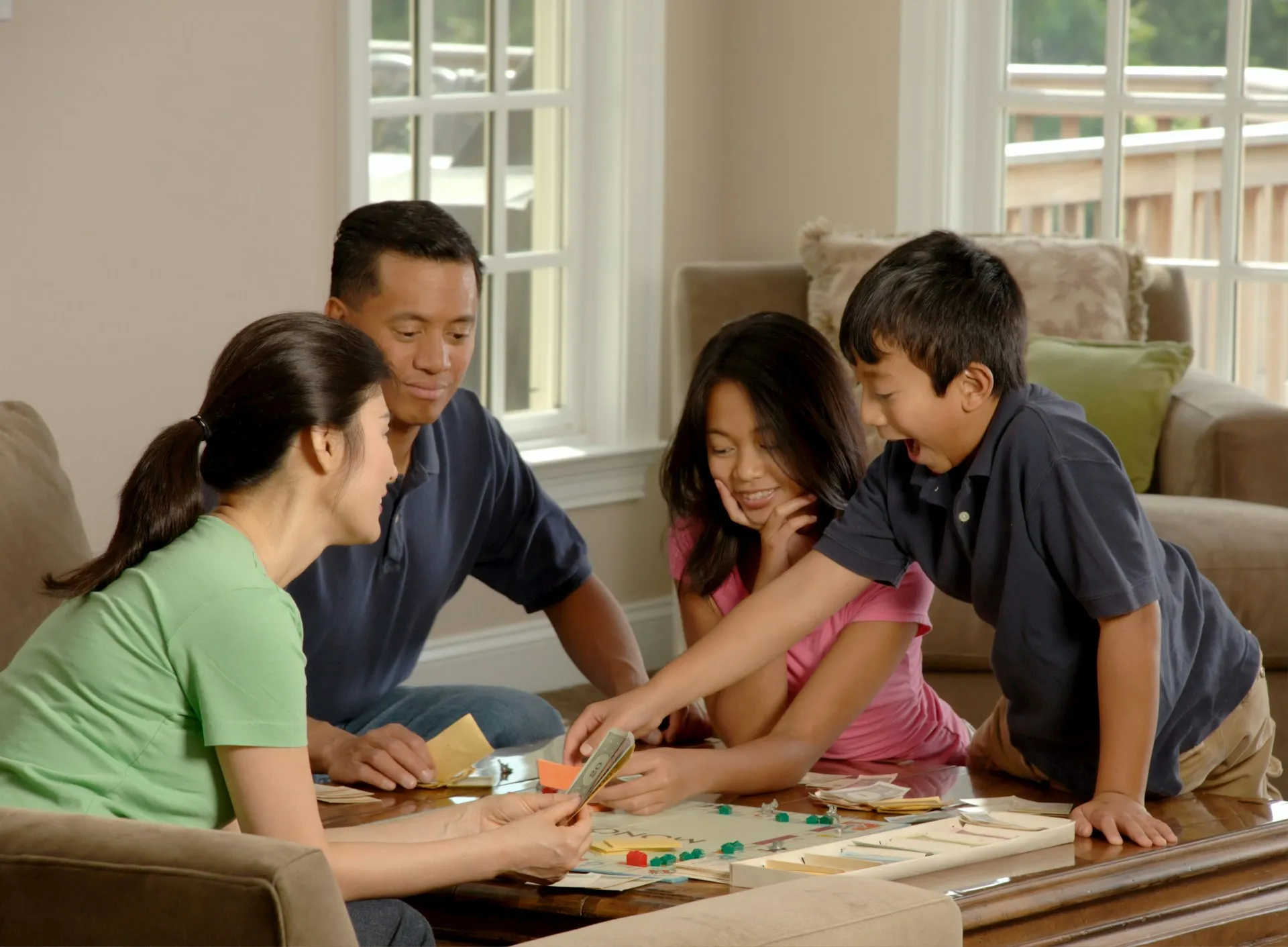 b4b9ce9e d453 433b 8fc3 85333f760428webp | ProCare Consulting Family playing board game together in a cozy living room, emphasizing engagement and interaction, relevant to discussions on family health insurance options in Florida.