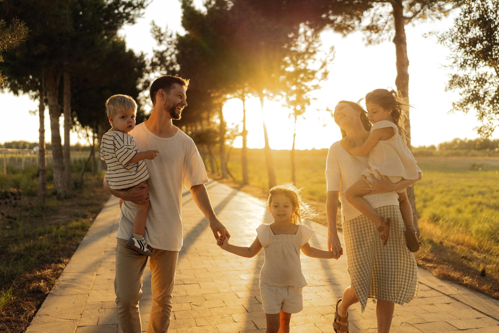 A Florida family walking together outdoors, representing how families explore Affordable Care Act health insurance options in Florida.