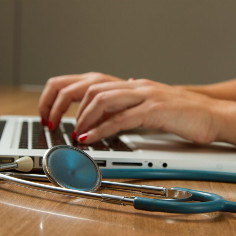 A doctor using laptop