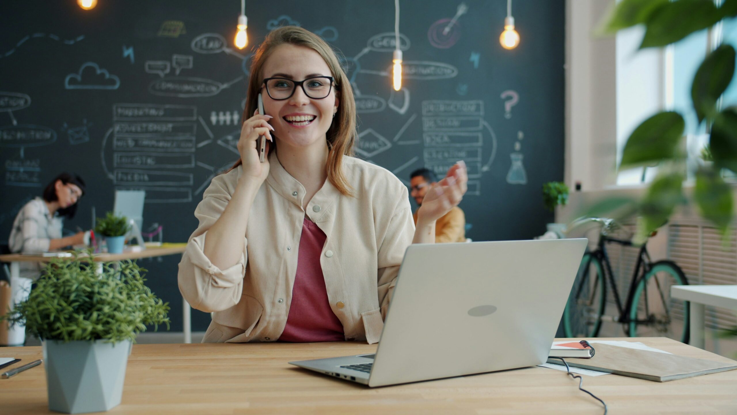 A small business professional working at a desk, illustrating why group health plans matter for supporting Florida small businesses and their employees.