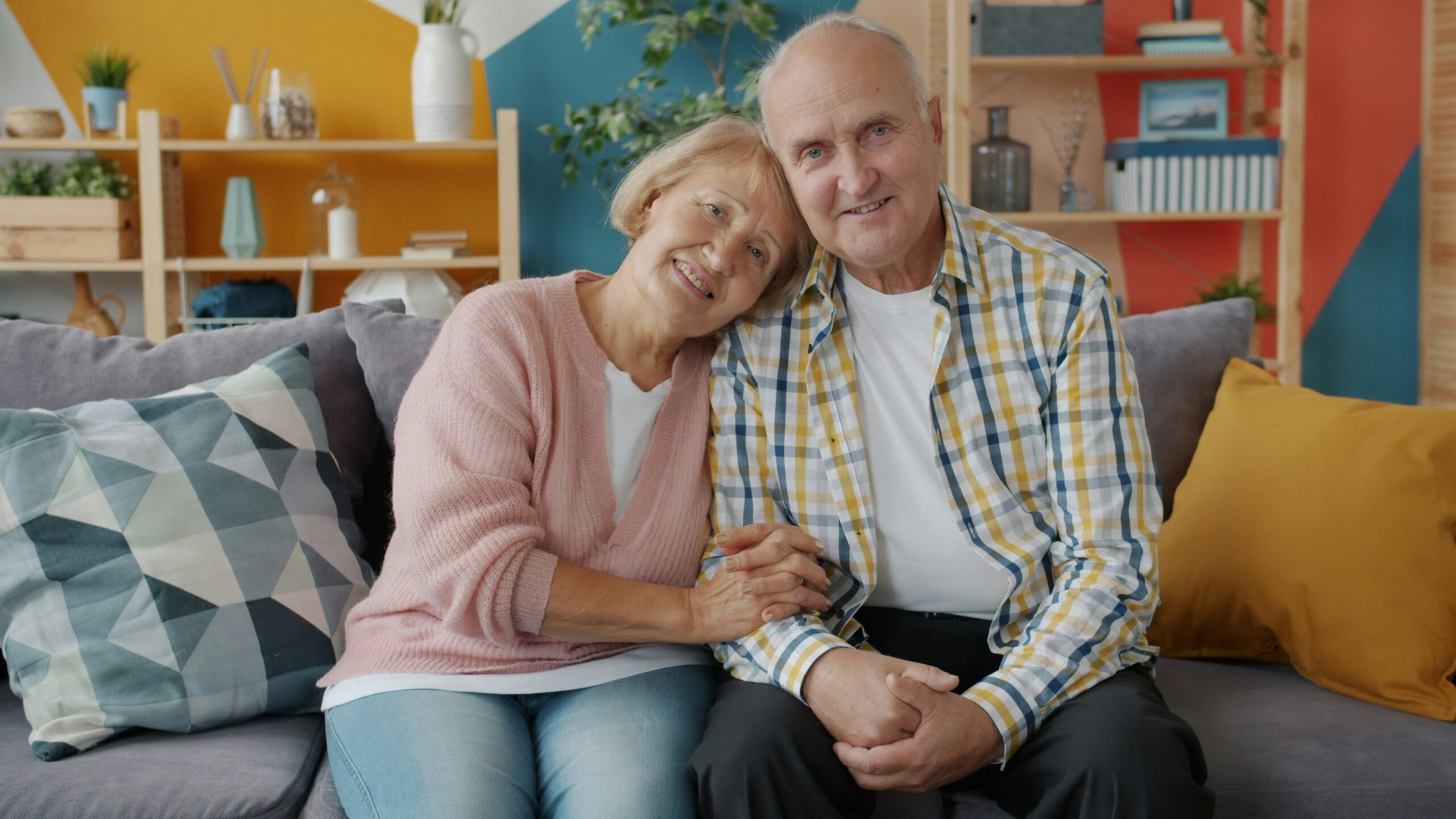 A Florida senior couple at home, representing Medicare costs and age-related considerations for retirees planning healthcare coverage.