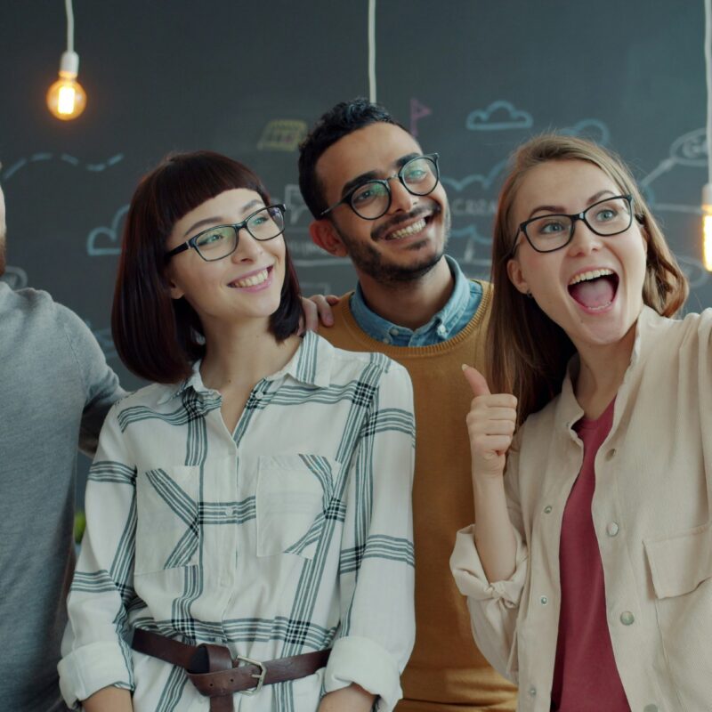 A happy team celebrating after finding the best group health insurance plans in Florida today.