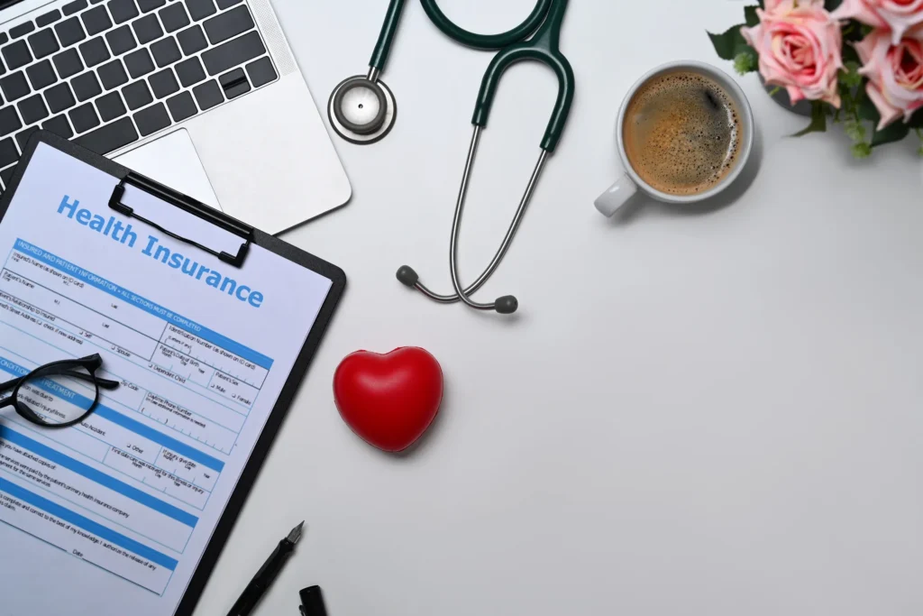 Health insurance application form with medical tools symbolizing how Florida residents can find their ideal private health insurance plan today.