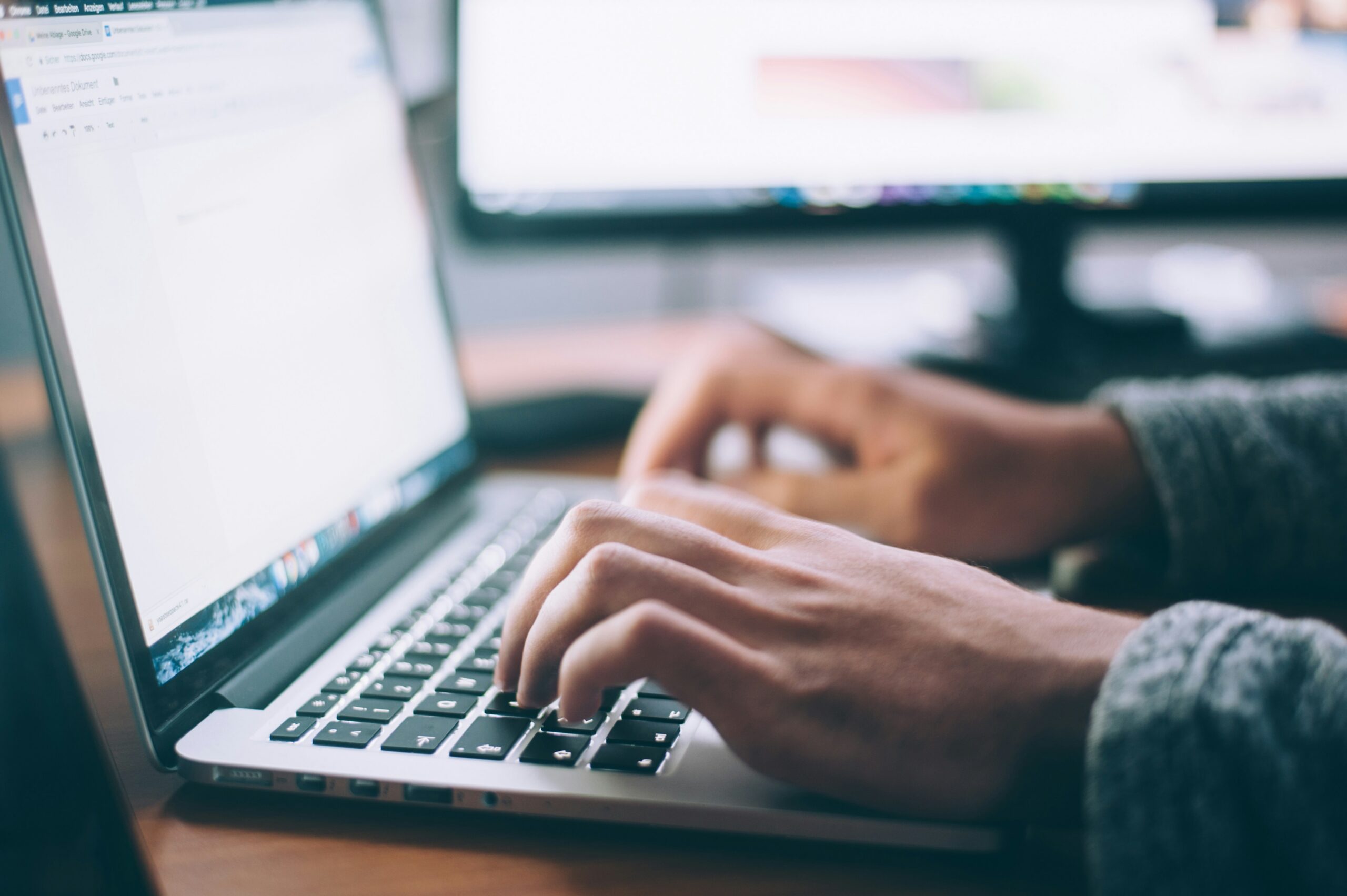 hands typing into laptop | ProCare Consulting hands typing into laptop