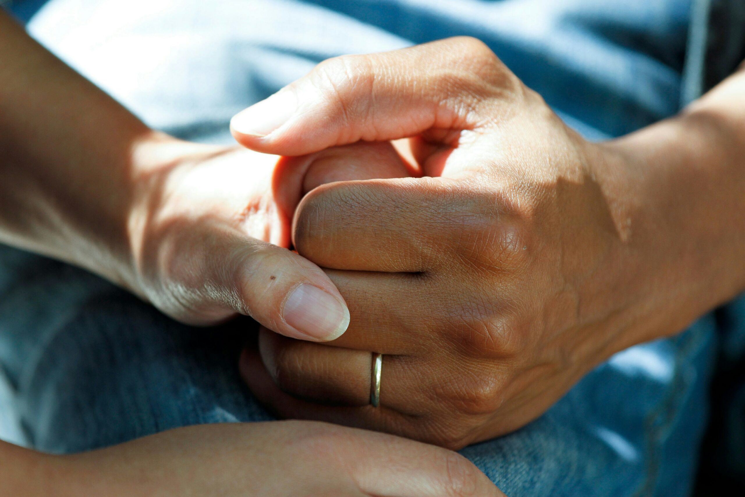 Patient and doctor holding hands