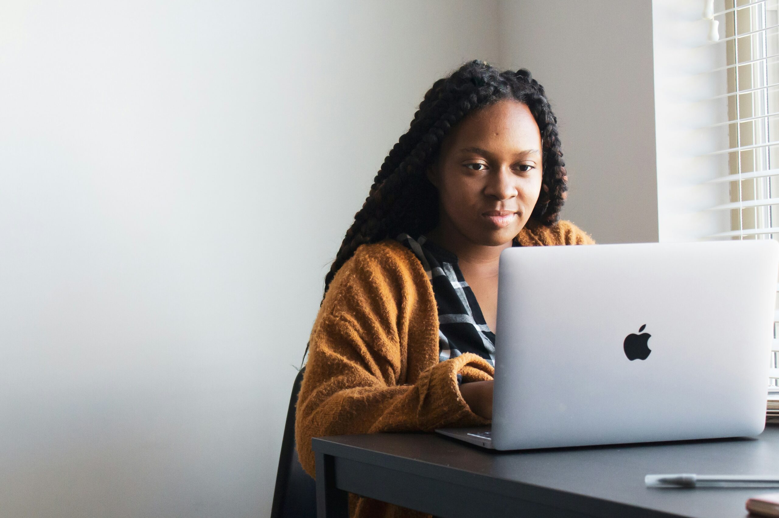 Person completing health insurance enrollment on a laptop | ProCare Consulting Person completing health insurance enrollment on a laptop