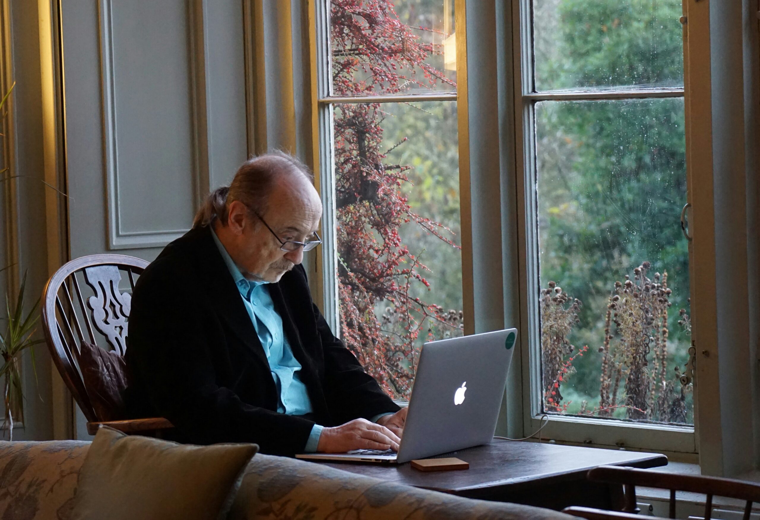 photo 1609131257008 a5436a6238dajpeg | ProCare Consulting Senior man reviewing Medicare plan options on tablet