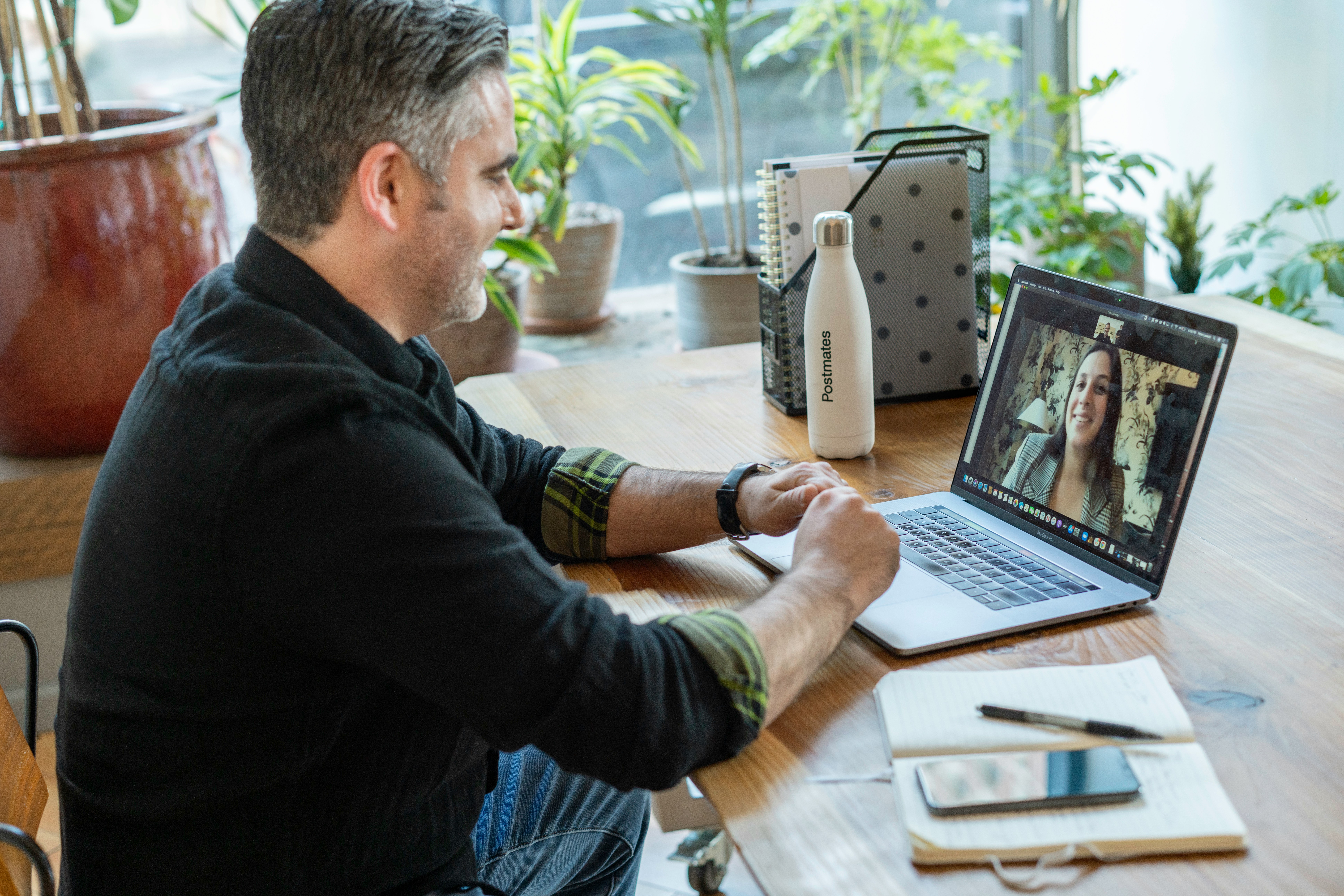 Man discussing prescription drug coverage and ACA Marketplace plan details during a virtual consultation.