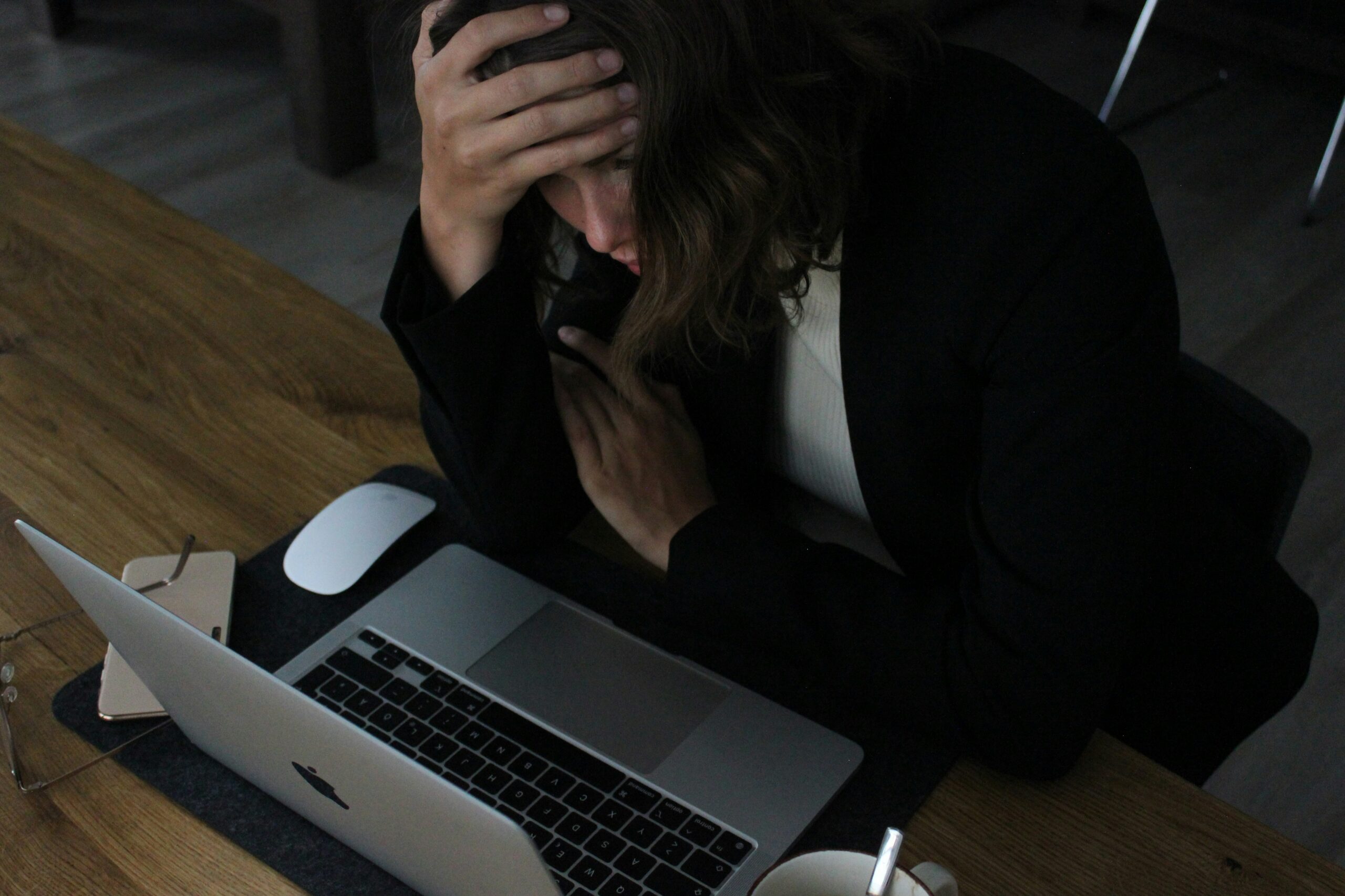 Business owner evaluating health insurance coverage options and employee benefits online. | ProCare Consulting Business owner evaluating health insurance coverage options and employee benefits online.