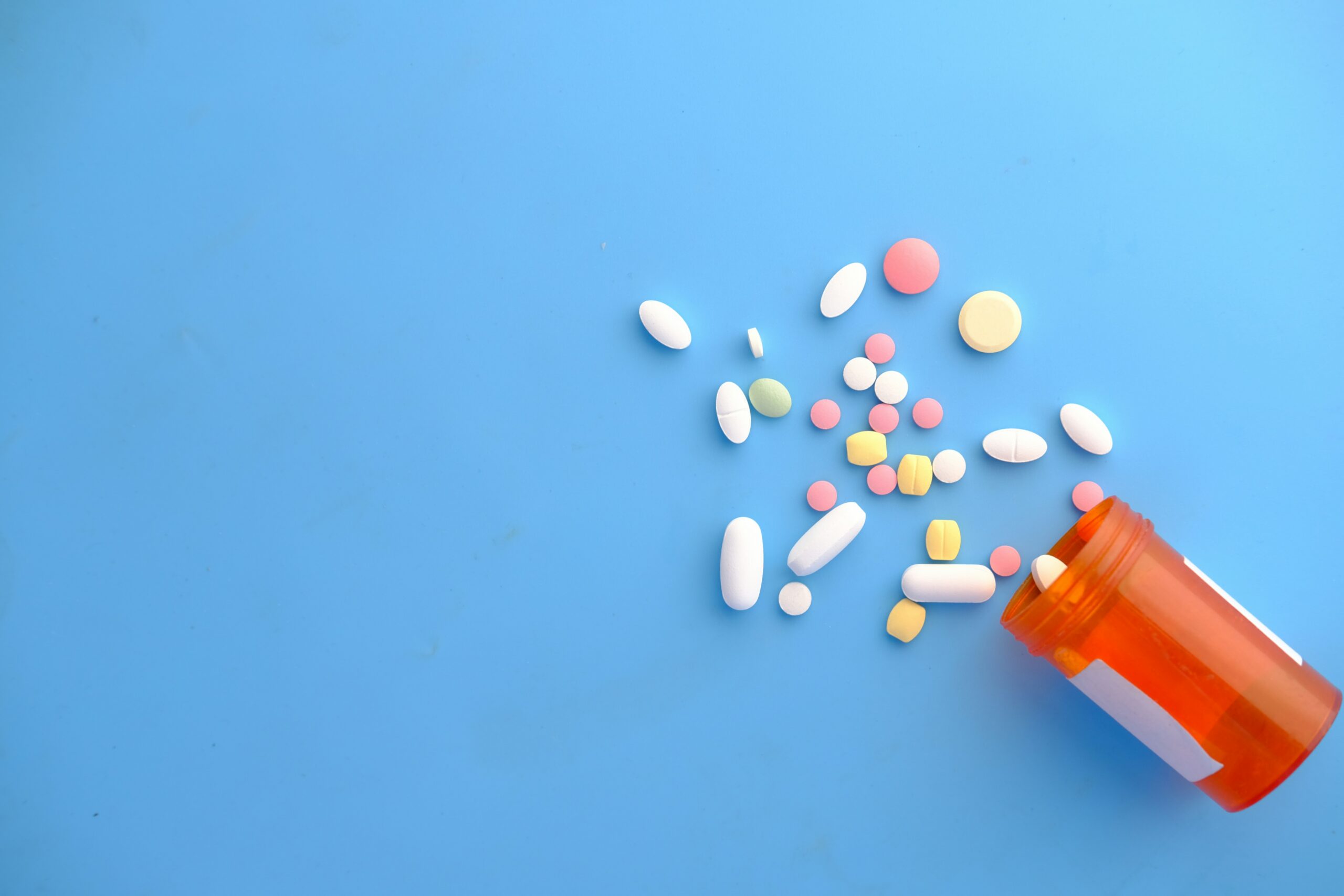 Medicines placed on blue surface