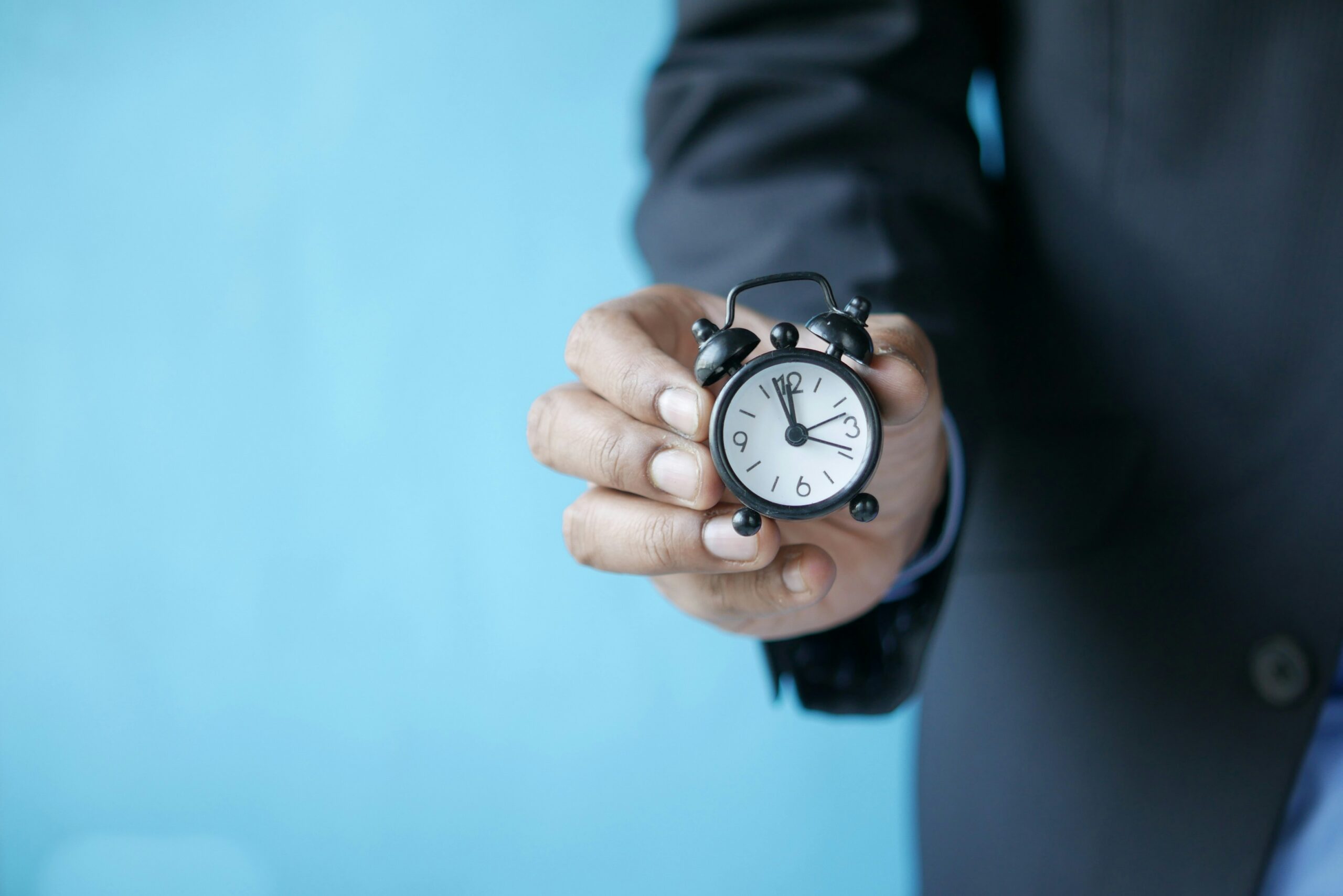 A man showing clock | ProCare Consulting A man showing clock