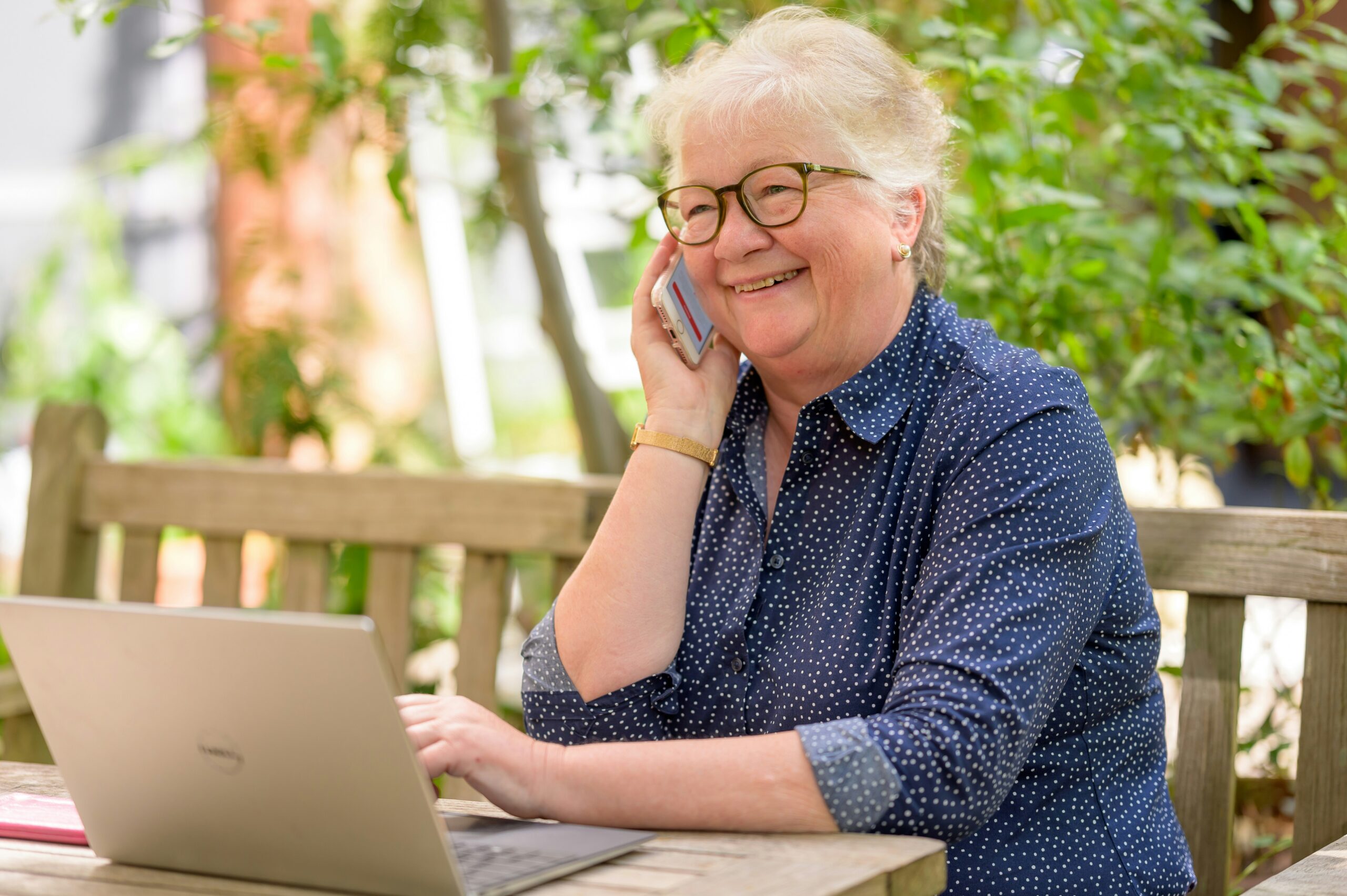 A senior citizen making call