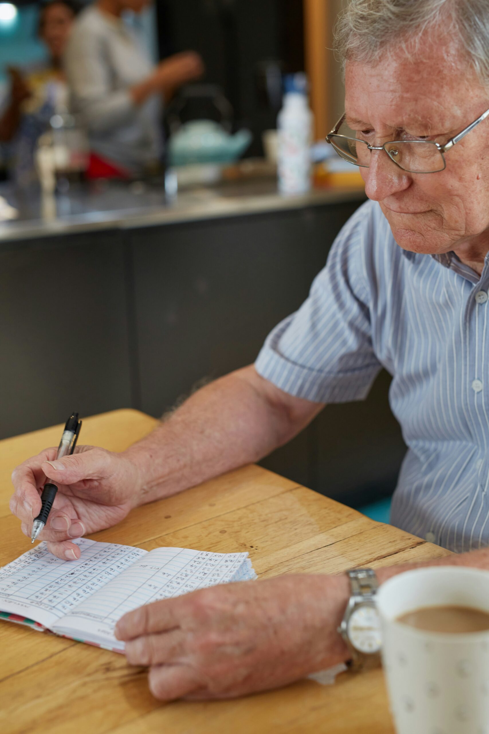 Senior man reviewing health insurance and Medicare coverage information on a laptop. | ProCare Consulting Senior man reviewing health insurance and Medicare coverage information on a laptop.