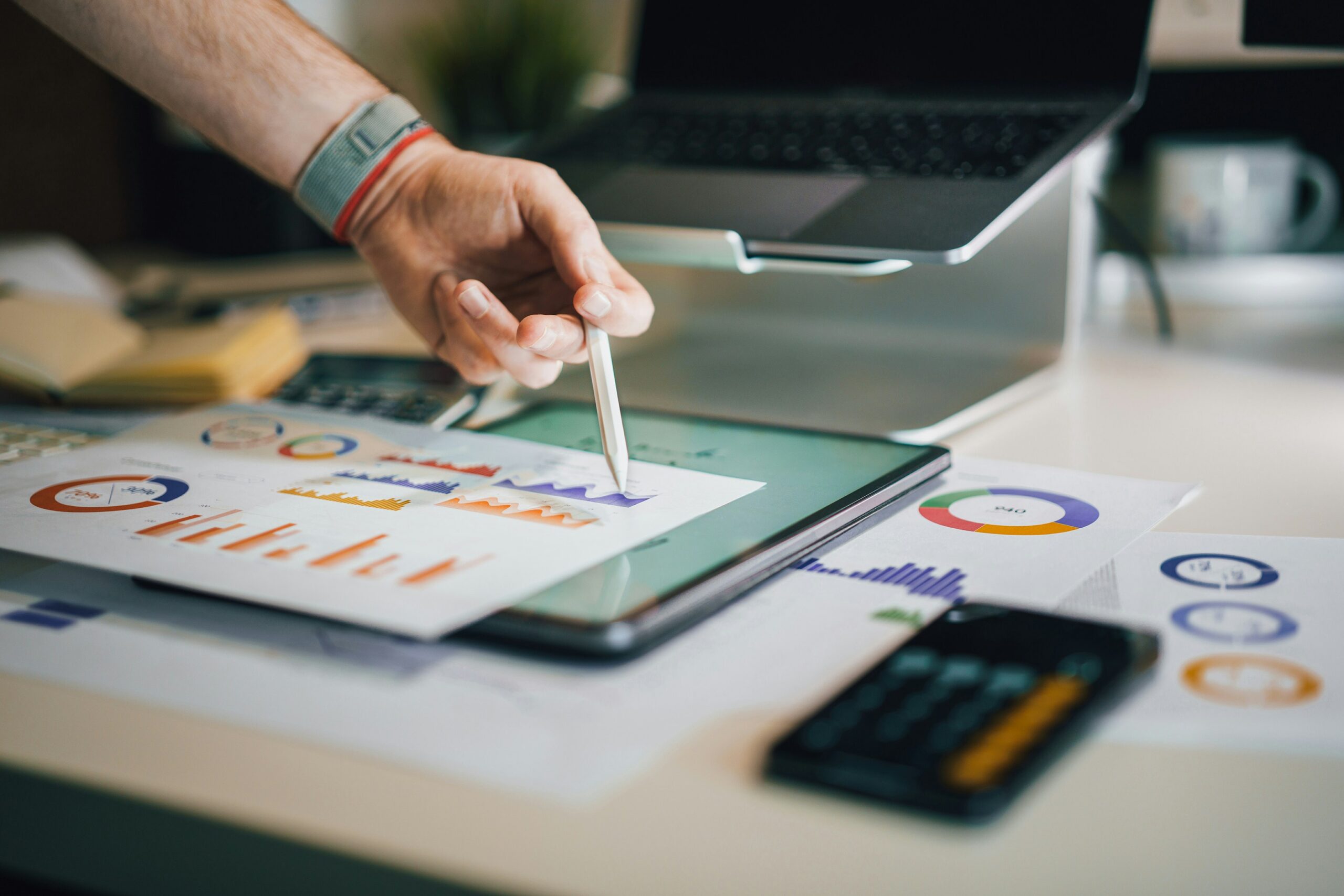 A laptop with mobile | ProCare Consulting A laptop with mobile