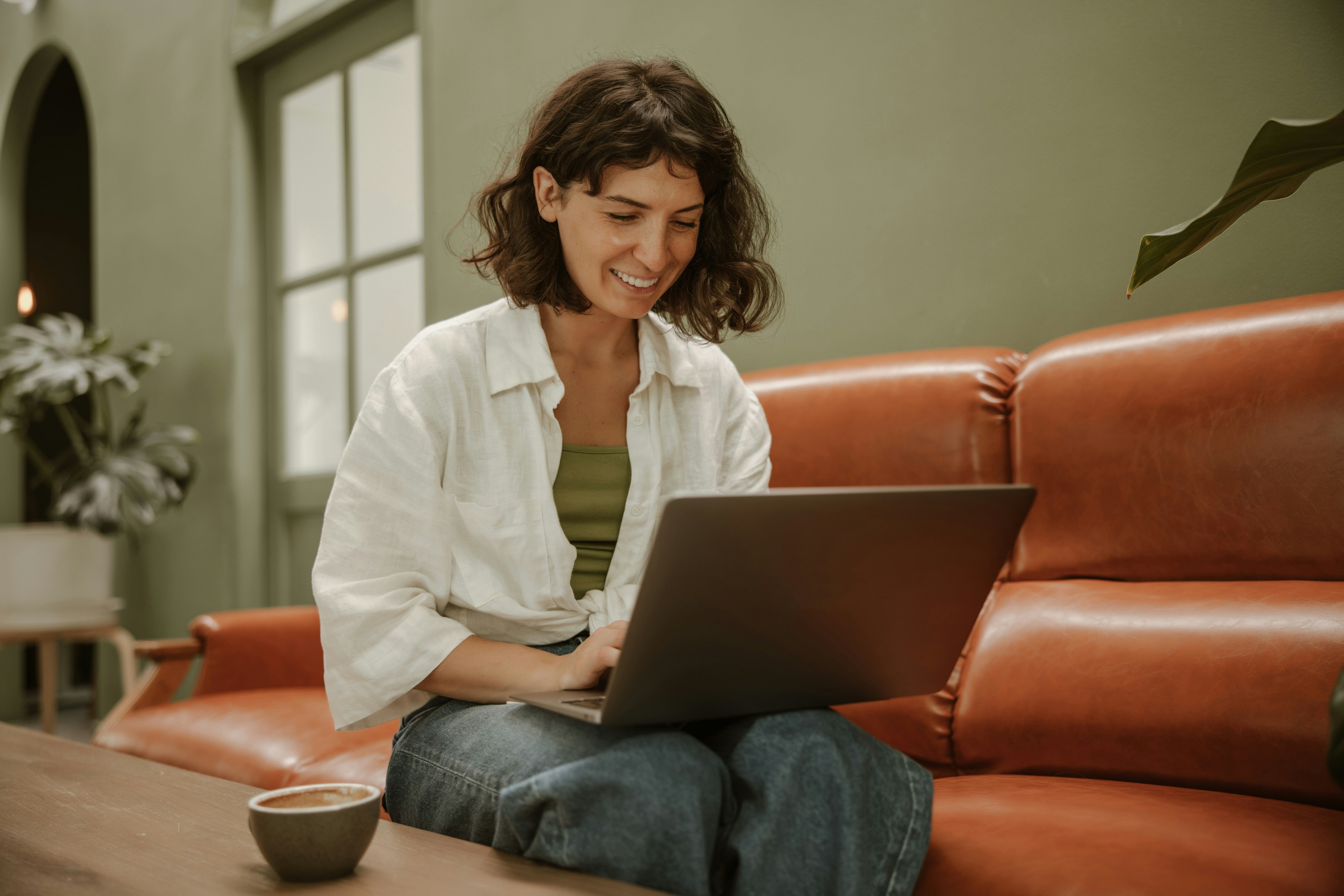 Woman researching ACA Marketplace provider networks on a laptop at home.