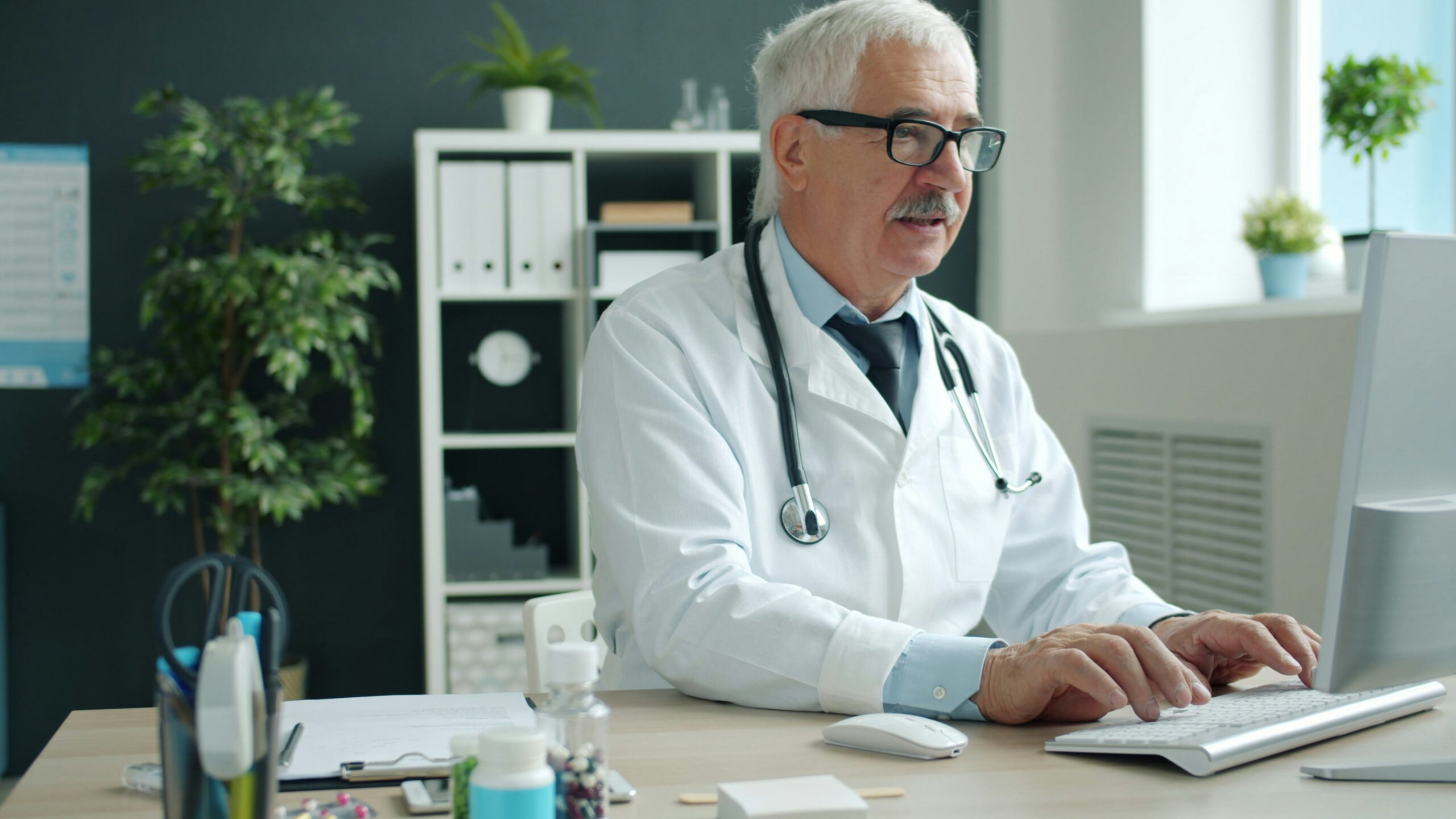 photo 1758691461888 b74515208d7ajpeg | ProCare Consulting Senior man reviewing Medicare options while using a laptop at home