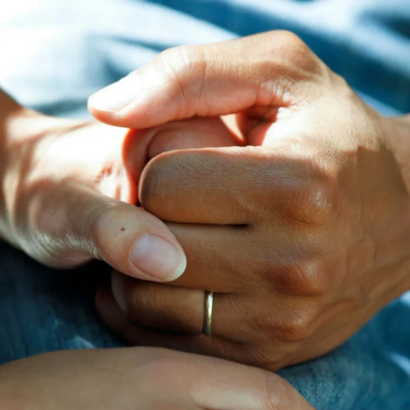 two people holding hands