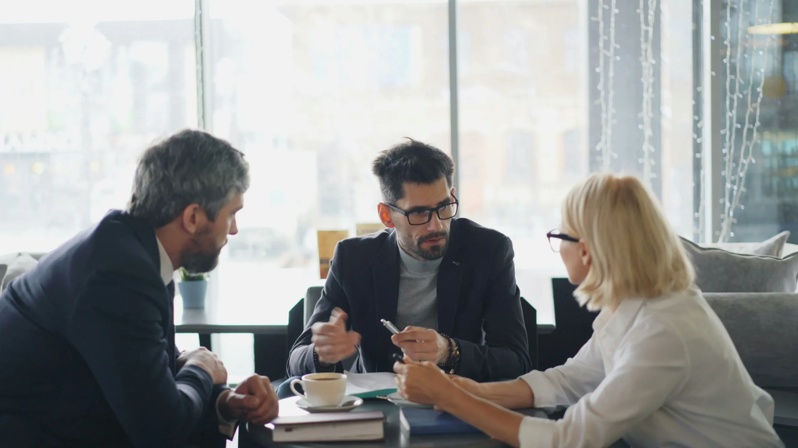 Business owners and advisor discussing health insurance strategy for a growing electrical contracting company | ProCare Consulting Business owners and advisor discussing health insurance strategy for a growing electrical contracting company