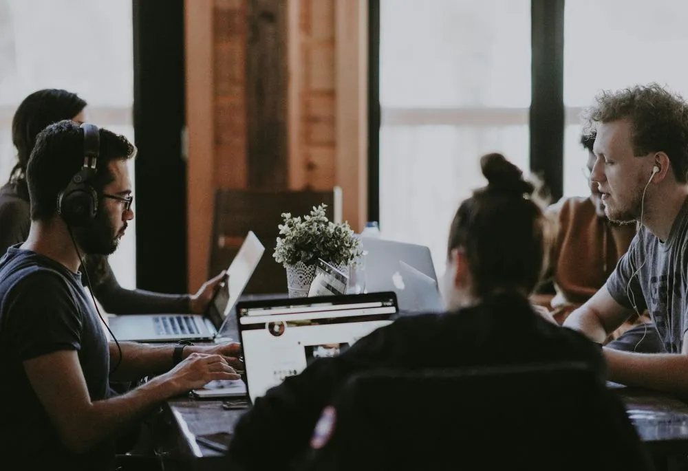 Business team reviewing employee locations, provider networks, and group health plan options | ProCare Consulting Business team reviewing employee locations, provider networks, and group health plan options
