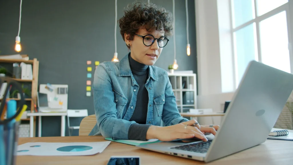 Individual reviewing health coverage options on a laptop