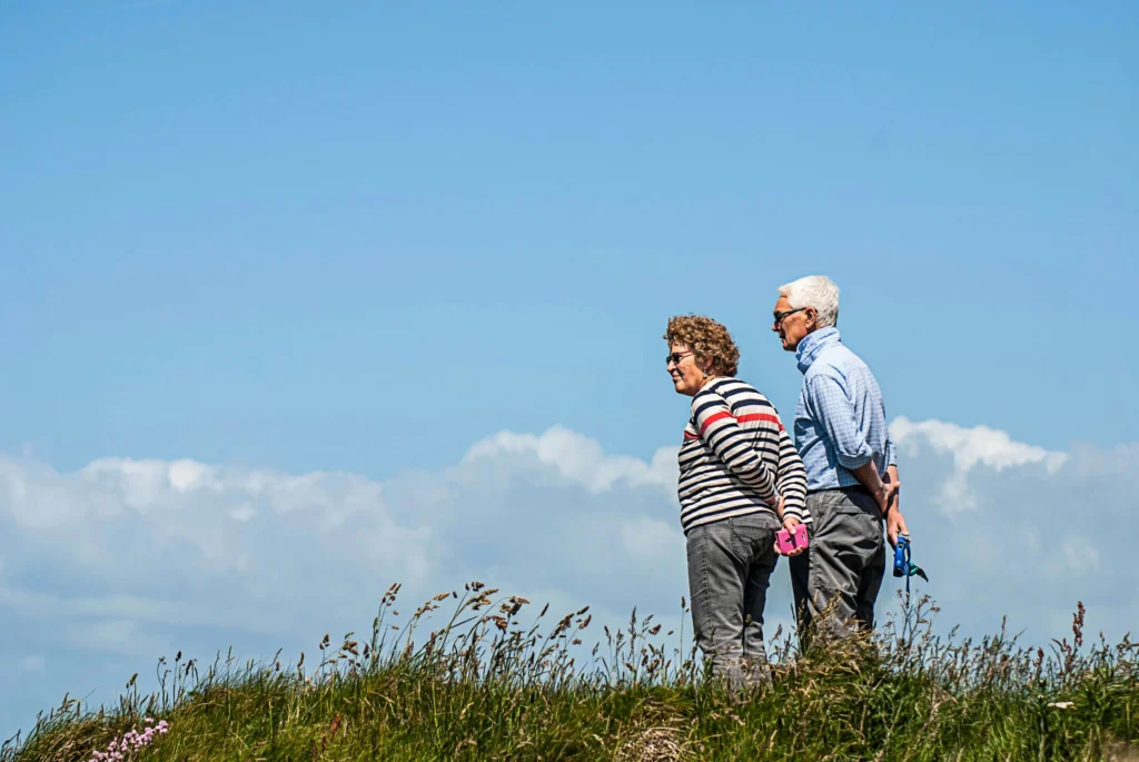 Older couple walking together outdoors