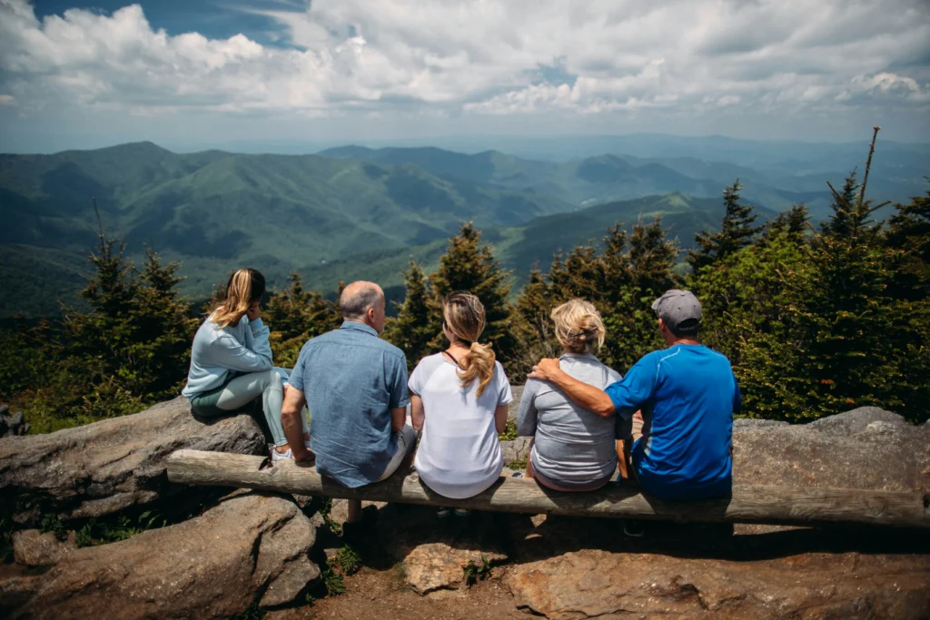 A family overlooking a mountain landscape